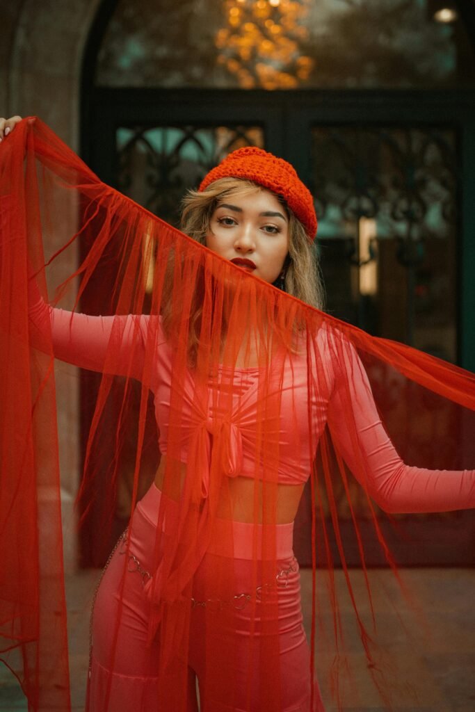 a model with red stylist themed outfit